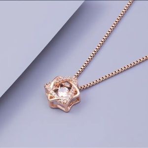 Beautiful Rose Gold Star of David necklace with faux diamonds!